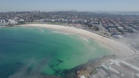 Sea-Fog-At-Bondi-Beach,-Rare-Phenomenon-In-NSW,-Australia---aerial-shot