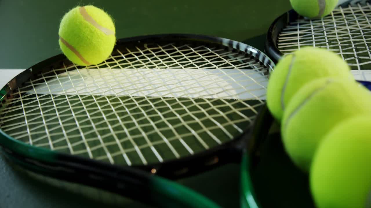 Racket and tennis ball in court 4k