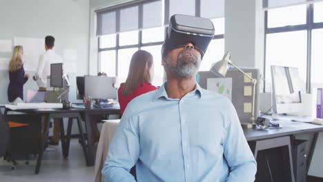 Businessman using VR headset in modern office