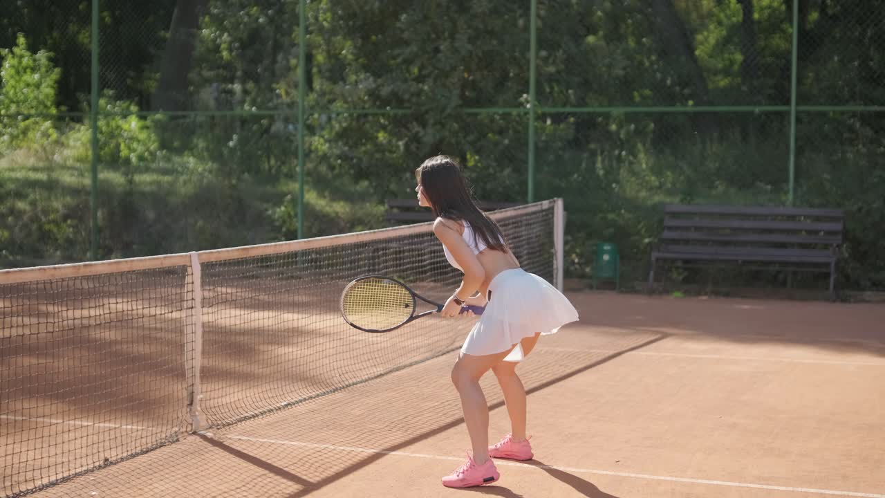 Female Tennis Player Practicing Serve on Outdoor Court