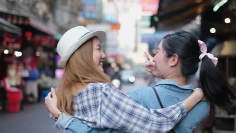 asian tourist woman taking a selfie with omelet in bangkok city.