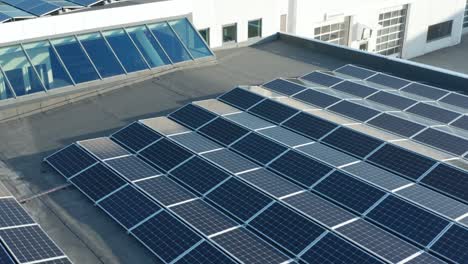 photovoltaic solar panel array, close up drone aerial view. sustainable energy system installment on modern building