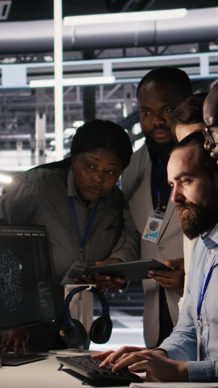 Vertical video Admins doing brainstorming in server hub, reviewing machine learning code