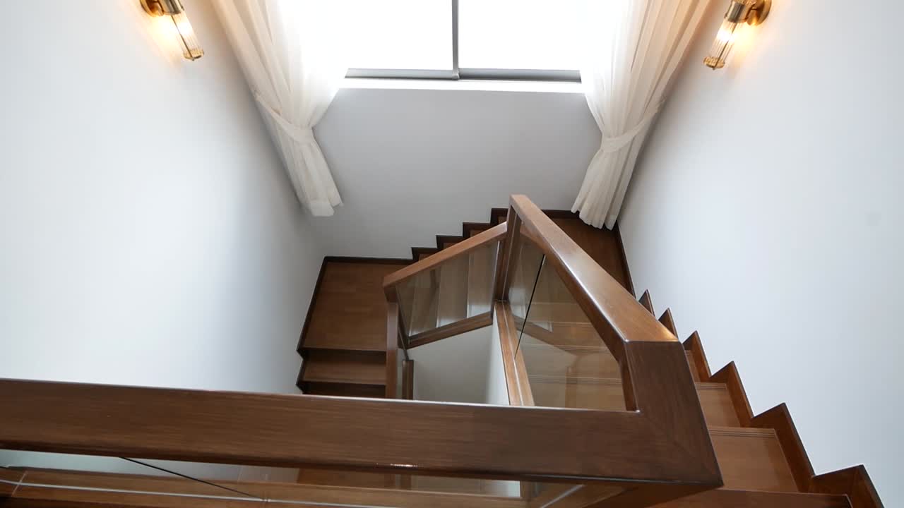 Nice and Clean Shiny Wooden Stairway and White Wall