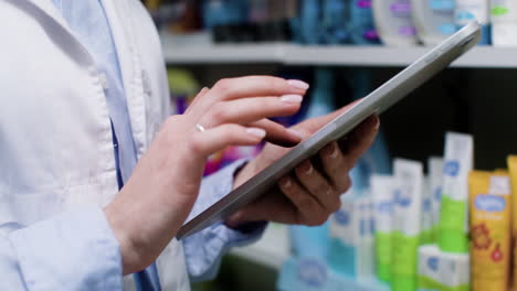 Young-woman-using-tablet-indoors