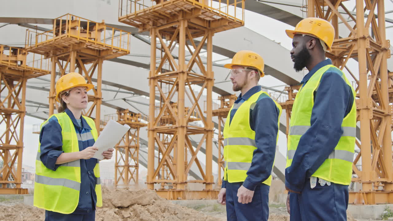 Supervisor Instructing Workers at Construction Site