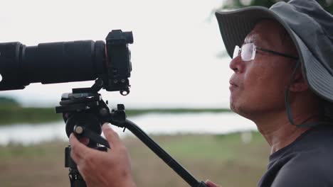 Photographer taking pictures outdoors