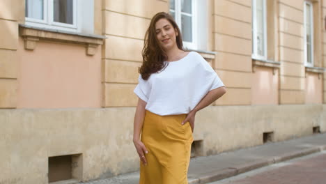 portrait of a beautiful woman smiling and looking at camera in the old town street 1