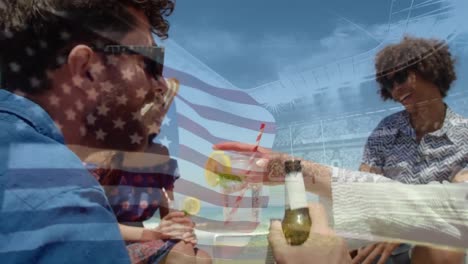 Animation-of-waving-flag-of-usa-over-group-of-friend-having-fun-on-the-beach