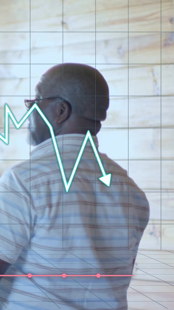 Vertical video: Man fixing glasses, moving right by wall, causing finance chart dipping over body