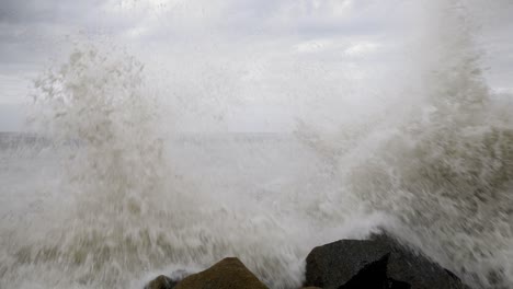 Wave-crashing-on-jetty,-Santa-Monica-CA