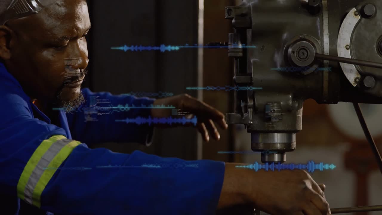 Male operator running milling machine in machine shop, displaying blue waveform animation overlays