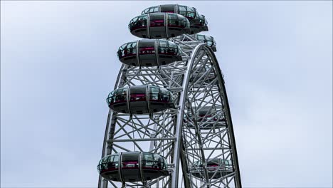 view of the london eye with clouds and blue sky in the background - millennium wheel, london