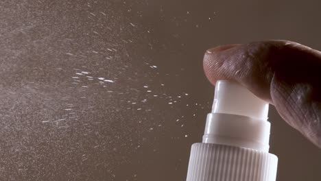 liquid spraying fountain in a super slow motion of vaporized liquids particles. shot on super slow motion camera 1600 fps. spraying perfume