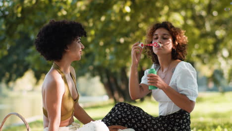 couple making bubbles outdoors