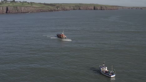 irish coast guard preparing to tow stricken fishing boat back to port