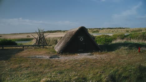 orbit sod hut or dwelling houses in european sand dunes nature