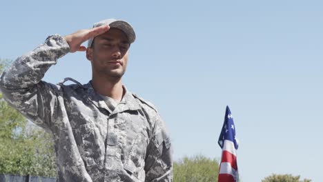 biracial male soldier saluting outside the house, unaltered, copy space, slow motion