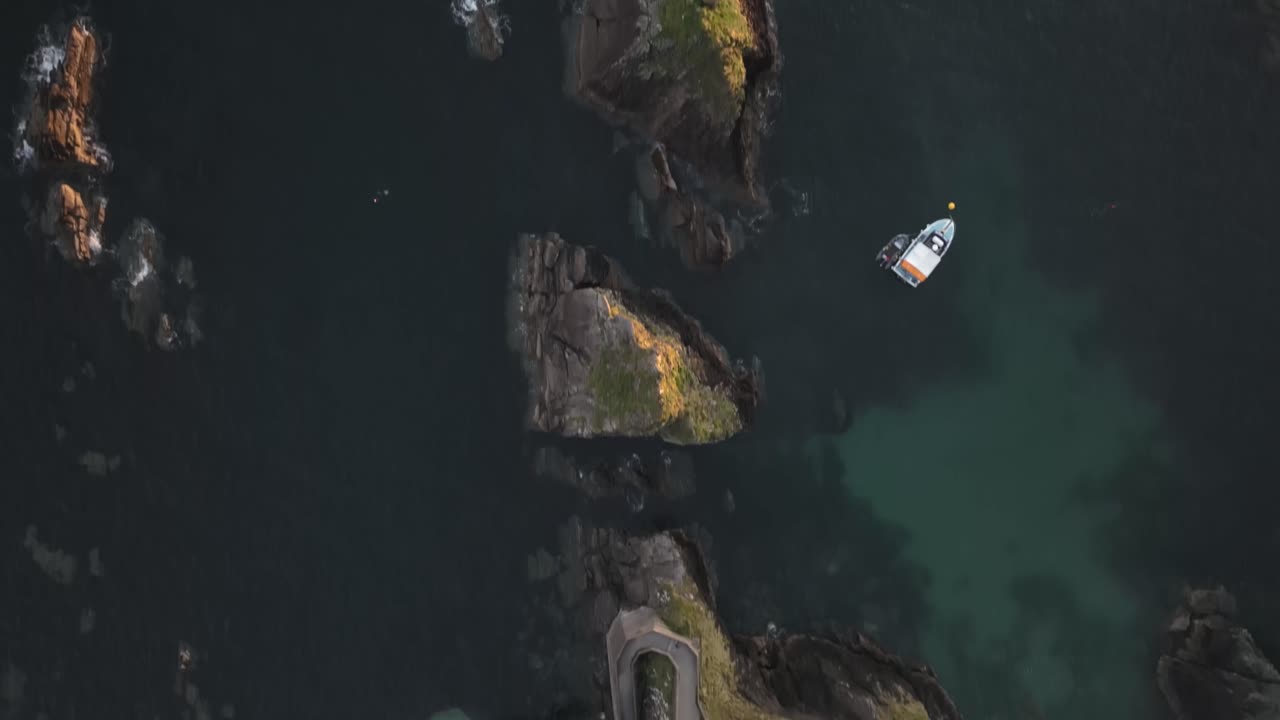 Golden sunset light over Dunquin Pier, with dramatic skies and sea views - Dingle Co.Kerry - 4K Cinematic Drone Footage 10