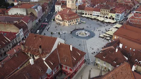 Backward-drone-footage-of-Braslov-old-town-with-black-church-in-Romania