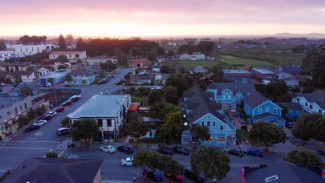 aerial footage above downtown half moon bay california at sunset