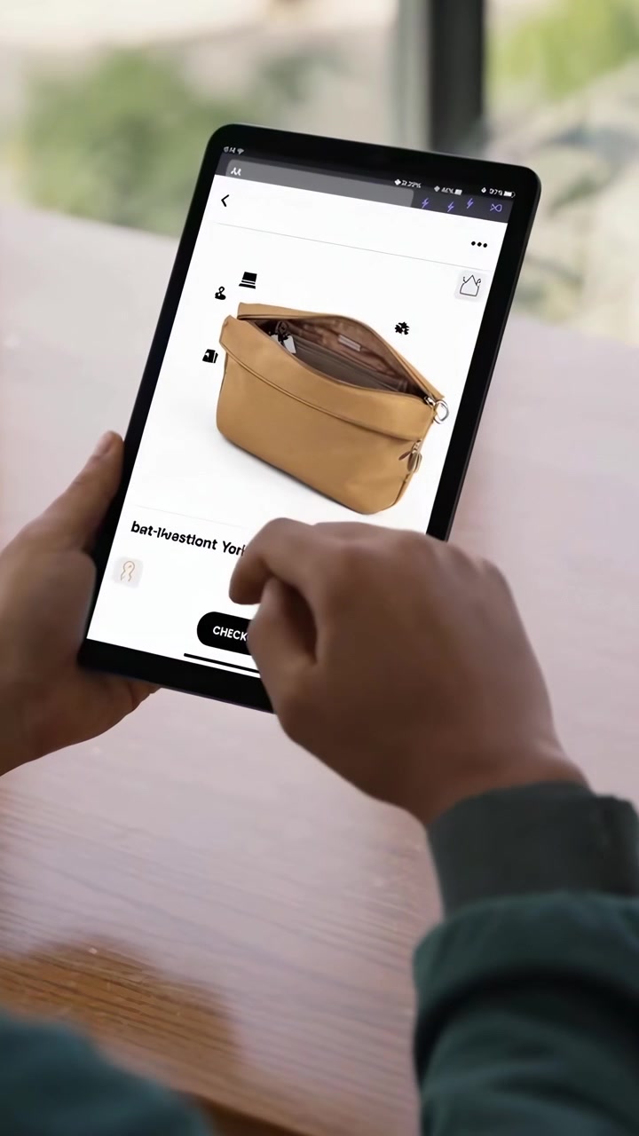 Person Shopping for Handbags on a Tablet