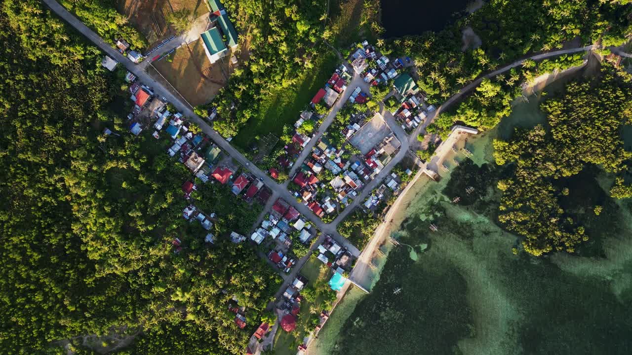 Stunning aerial top-down view of quaint coastal barangay village at Yocti, San Andres, Catanduanes with lush greenery.