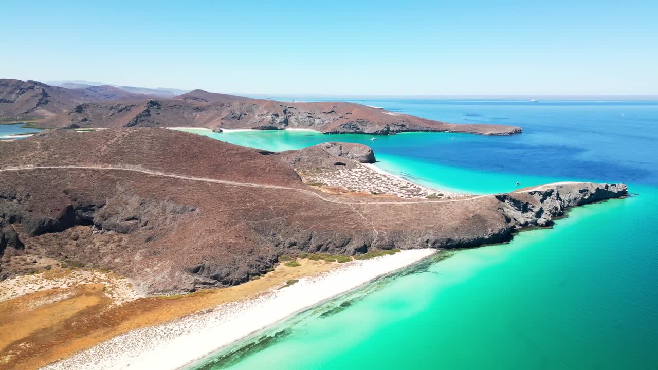 Beautiful aerial view of La Paz Tecolotito beach with turquoise waters and rocky landscape