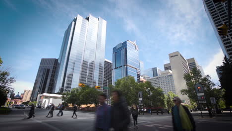 cinematic time lapse of a downtown intersection with towering skyscrapers