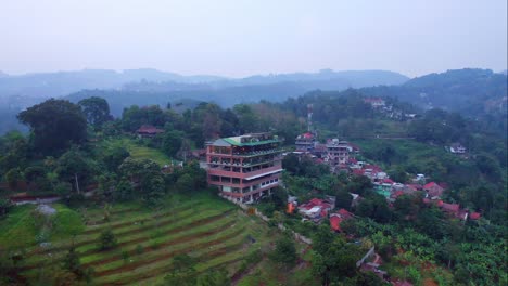 Aerial-view-of-Skyline-Best-View-Resto-on-a-hill-in-Bandung-city,-West-Java---Indonesia