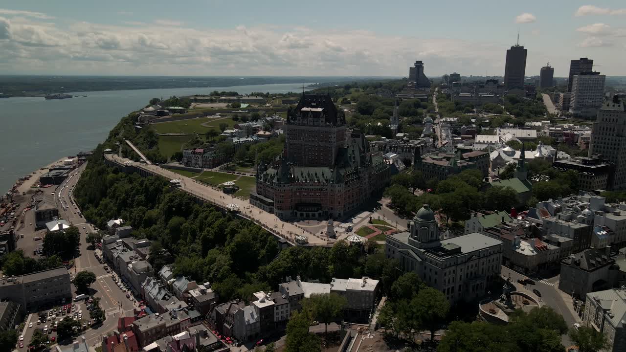Aerial view of splendid Hotel Chateau Frontenac during summer, moving backward