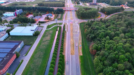 modern highways crossing the countryside. drone footage over the roads at sunset time.