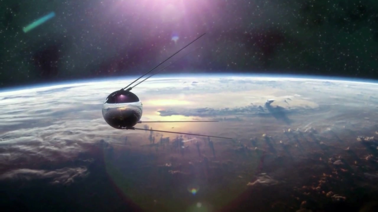 Animation of the historic Sputnik 1 satellite orbiting planet Earth. Realistic vintage Soviet spacecraft with long antennas in space during sunrise with lens flare.