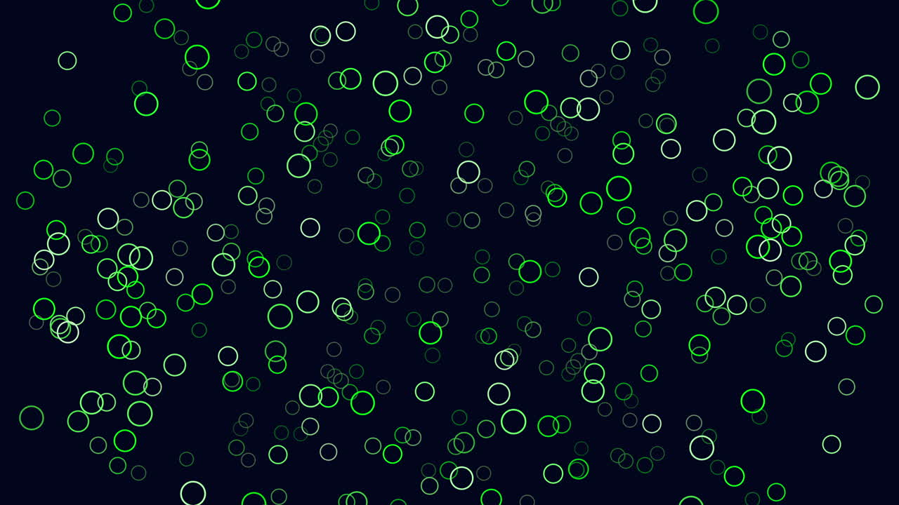 Filmato astratto in movimento di particelle ad anello verde neon che fluttuano e scintillano su uno sfondo blu scuro, creando un motivo bokeh futuristico per elementi visivi di tecnologia, dati e fantascienza.