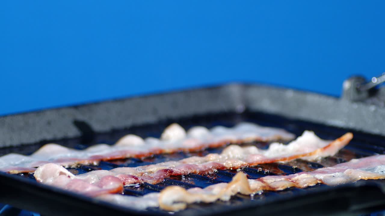 Chopped bacon into pieces fry with air bubbles and hot steam.
