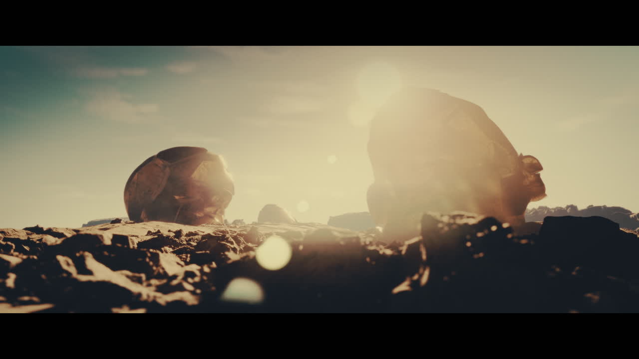 Huge golden statues in the desert during sunset