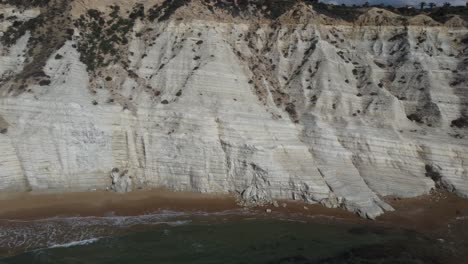 lateral slide along white cliffs on the coast of the mediterranean sea in italy