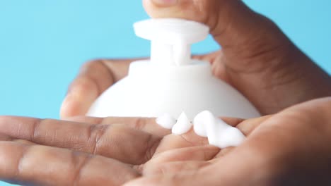 applying lotion to hand