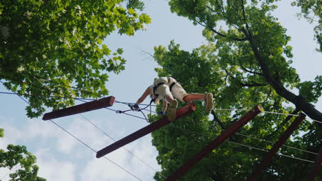 A-Brave-Niño-Takes-Steps-On-A-Staggered-Cable-At-A-Height-Overcome-Fear-Concept