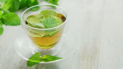 cup of green tea with mint and lemon