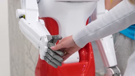 Handshake of a Girl and Work in the Future Handshake of a Girl and Work in the Future a Sign of Friendship and Mutual Understanding between Modern Technologies Slow Motion