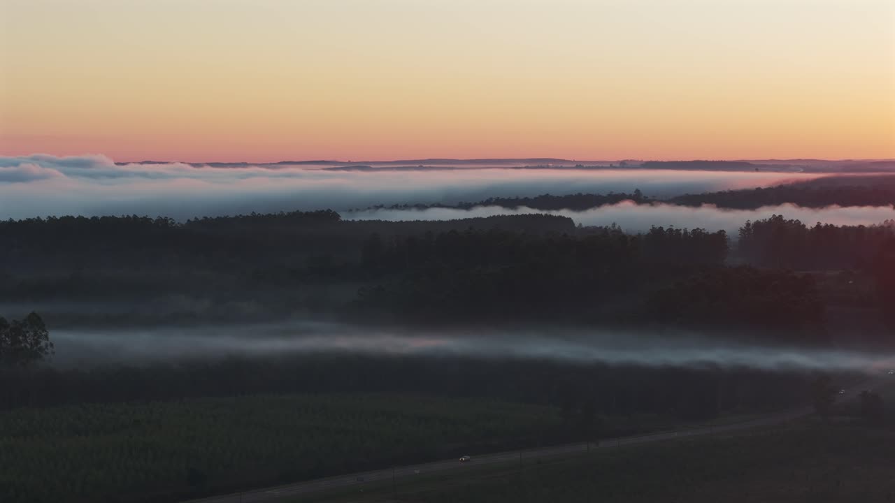 Sunrise over Foggy Landscape