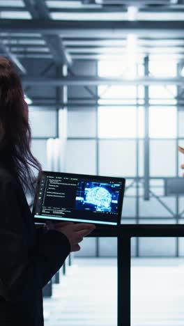 vertical video software developers in data center use ai technology on tablet