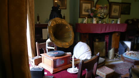 classic living room with a gramophone, vintage furniture, and warm drapery, embodying early 20th-century decor