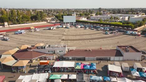 Discover-the-vibrant-energy-of-Paramount's-swap-meet-and-experience-the-nostalgia-of-a-drive-in-movie-with-a-towering-screen-in-this-lively-time-lapse-drone-video