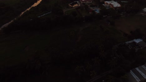 Tilt-up-Reveal-Of-Soriana-Hypermarket-And-The-Home-Depot-On-Peninsula-de-Santiago-At-Sunset-In-Manzanillo,-Mexico