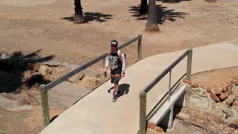 man  walking in a park in australia