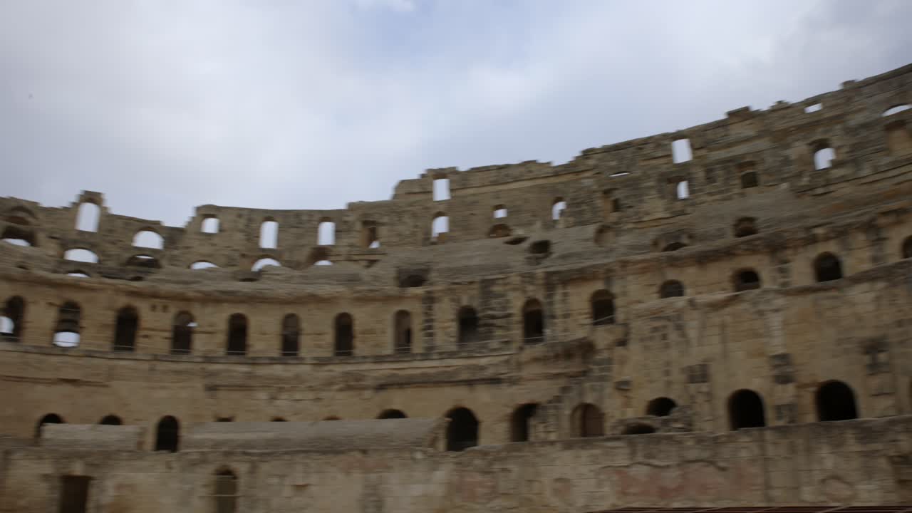 Famous Archeological Landmark Of El Jem Amphitheater In Tunisia - panning shot