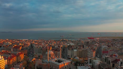 istanbul at sunset, turkey. aerial view of buildings roofs on sea background.