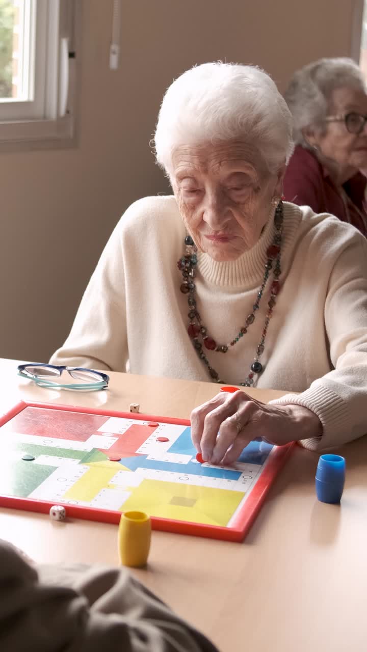 Senior people playing board game in retirement home